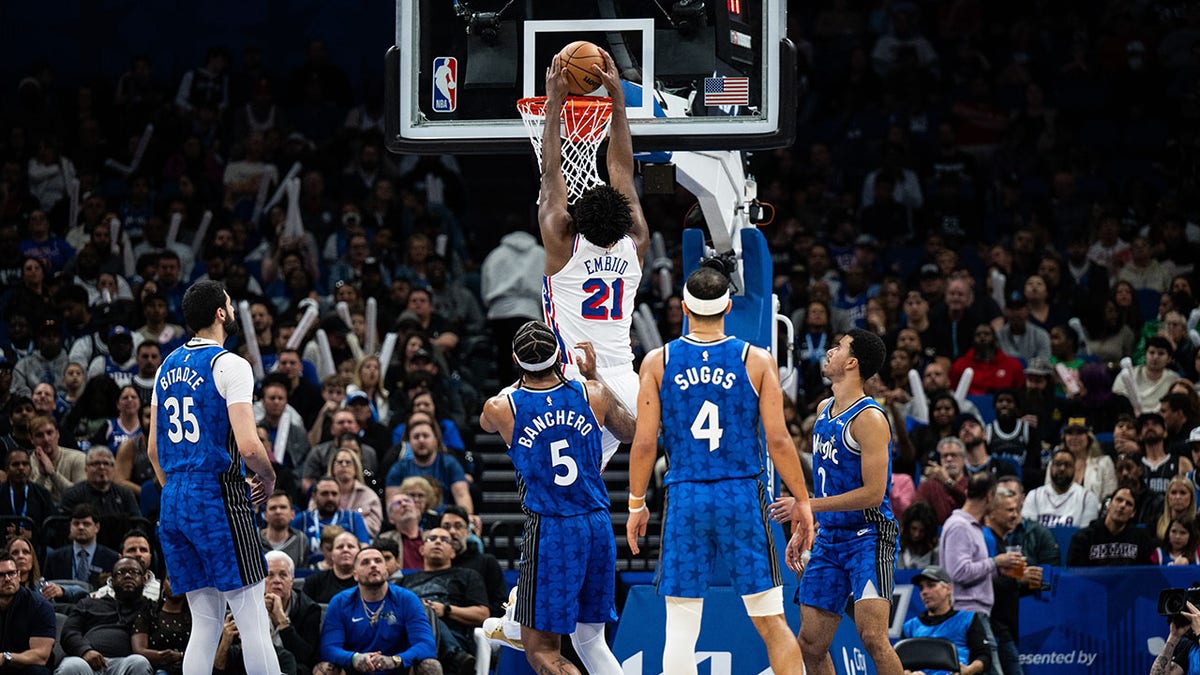 Joel Embiid dunks the ball