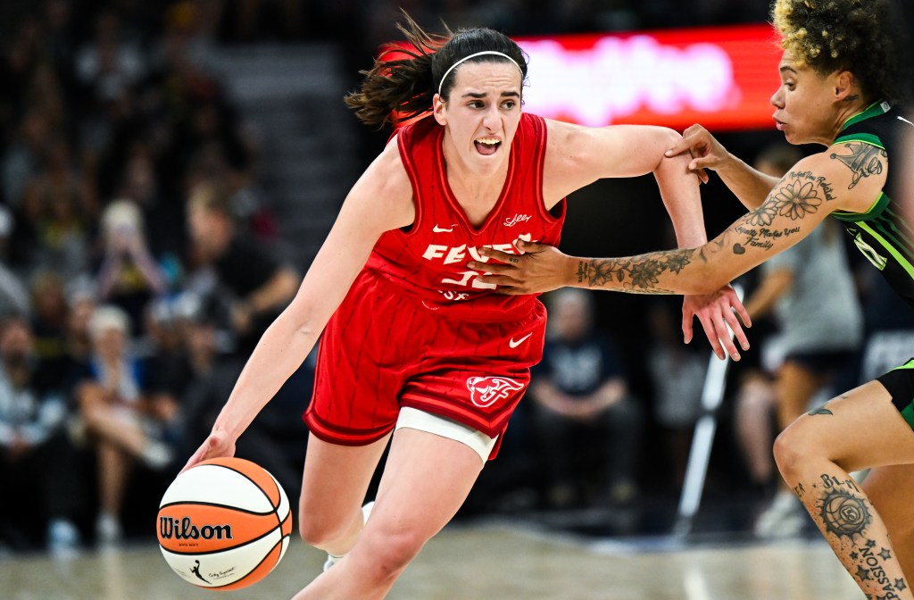 Caitlin Clark, who scored 23 points and had eight assists, drives on Natisha Hiedeman during the Fever's 90-80 loss to the Lynx on Aug. 24, 2024. 