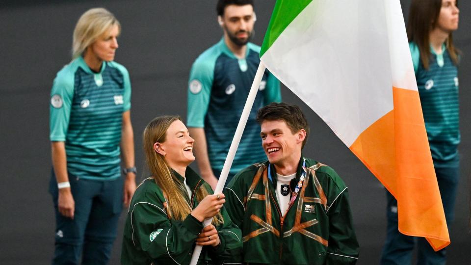 Ireland flagbearers Mona McCarthy and Fintan McCarthy laugh during the Olympic Games closing ceremony