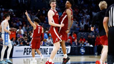 Grant Nelson #2, Aaron Estrada #55 and Mark Sears #1 of the Alabama Crimson Tide celebrate after defeating the North Carolina Tar Heels during the second half in the Sweet 16 round of the NCAA Men's Basketball Tournament.