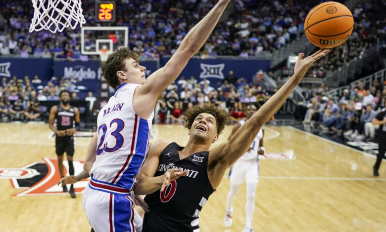 Dan Skillings and Cincinnati knocked off Kansas to reach the quarterfinals of the Big 12 tournament on Wednesday night.