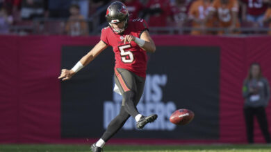 Tampa Bay Buccaneers punter Jake Camarda (5) tries an onside kick during an NFL football game against the New Orleans Saints, Sunday, Dec. 31, 2023, in Tampa, Fla. (AP Photo/Peter Joneleit)