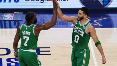 Jaylen Brown #7 of the Boston Celtics and Jayson Tatum #0 of the Boston Celtics high five during the second quarter in Game Four of the Eastern Conference Finals at Gainbridge Fieldhouse on May 27, 2024 in Indianapolis, Indiana.