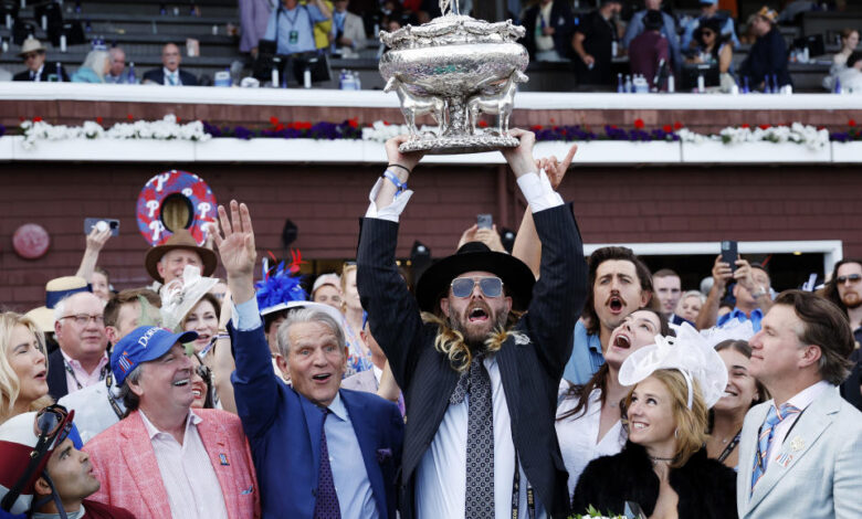 SARATOGA SPRINGS, NEW YORK - JUNE 08: Owner Jayson Werth (C) raises the trophy after Dornoch with Luis Saez up wins the 156th running of the Belmont Stakes at Saratoga Race Course on June 08, 2024 in Saratoga Springs, New York.  The race was moved to Saratoga while Belmont Park undergoes renovations. (Photo by Sarah Stier/Getty Images)