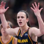 Indiana Fever guard Caitlin Clark (22) throws her hands up to the referee on Sunday, Sept. 15, 2024, during the game at Gainbridge Fieldhouse in Indianapolis.