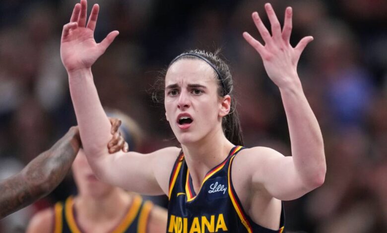 Indiana Fever guard Caitlin Clark (22) throws her hands up to the referee on Sunday, Sept. 15, 2024, during the game at Gainbridge Fieldhouse in Indianapolis.