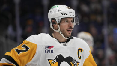 FILE - Pittsburgh Penguins' Sidney Crosby looks on during the second period of an NHL hockey game against the New York Islanders, April 17, 2024, in Elmont, N.Y. (AP Photo/Seth Wenig, File)