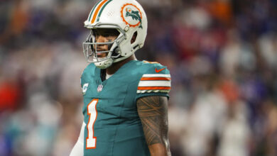 MIAMI GARDENS, FL - SEPTEMBER 12: Tua Tagovailoa #1 of the Miami Dolphins looks on from the field during an NFL football game against the Buffalo Bills at Hard Rock Stadium on September 12, 2024 in Miami Gardens, Florida. (Photo by Cooper Neill/Getty Images)