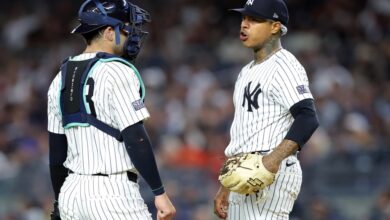 Austin Wells (left) talks with Marcus Stroman in the first inning of the Yankees' 9-7 loss to the Orioles on Sept. 25, 2024.