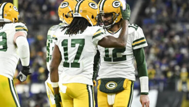 Dec 19, 2021; Baltimore, Maryland, USA; Green Bay Packers wide receiver Davante Adams (17) celebrates with quarterback Aaron Rodgers (12) after scoring a second quarter touchdown against the Baltimore Ravens at M&amp;T Bank Stadium. Mandatory Credit: Tommy Gilligan-Imagn Images