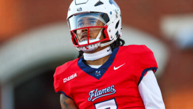 LYNCHBURG, VIRGINIA - OCTOBER 08: Kaidon Salter #7 of the Liberty Flames warms up before a football game against the Florida International University Panthers at Williams Stadium on October 08, 2024 in Lynchburg, Virginia.  (Photo by David Jensen/Getty Images)