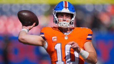 Denver Broncos quarterback Bo Nix (10) warms up before the game against the Las Vegas Raiders at Empower Field at Mile High.