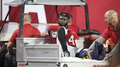 Tampa Bay Buccaneers wide receiver Chris Godwin (14) is carted off the field with an air cast during an NFL football game against the Baltimore Ravens , Monday, Oct. 21, 2024, in Tampa, Fla. (AP Photo/Peter Joneleit)