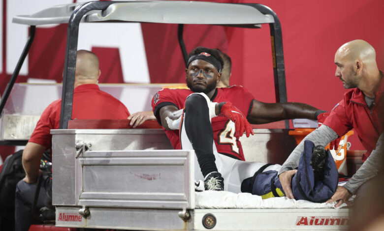 Tampa Bay Buccaneers wide receiver Chris Godwin (14) is carted off the field with an air cast during an NFL football game against the Baltimore Ravens , Monday, Oct. 21, 2024, in Tampa, Fla. (AP Photo/Peter Joneleit)