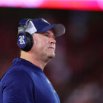 HOUSTON, TEXAS - SEPTEMBER 14: Mike Bloomgren head coach of the Rice Owls looks on against the Houston Cougars during the first half at TDECU Stadium on September 14, 2024 in Houston, Texas.  (Photo by Alex Slitz/Getty Images)