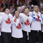 Team Canada players listen to the national anthem after winning the 2016 World Cup of Hockey.<p>Kevin Sousa-Imagn Images</p>