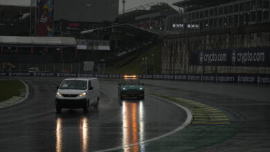 SAO PAULO, BRAZIL - NOVEMBER 2: Maintenance teams and race directors circulate around the Interlagos track to assess race conditions for qualifying, during a storm that hit the city of Sao Paulo on Saturday afternoon 2. After more than 1 hour of rain, qualifying was cancelled. (Photo by Stringer/Anadolu via Getty Images)