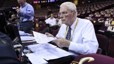 ABC television basketball analyst Hubie Brown goes over stats while sitting at the scorers table before Game 3 of the NBA Finals at Quicken Loans Arena in Cleveland, Ohio, on Tuesday, June 9, 2015. (Jose Carlos Fajardo/Bay Area News Group)