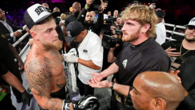 Dec 15, 2023; Orlando, Florida, USA; Jake Paul is congratulated by Logan Paul after knocking out Andre August in the first round at the Caribe Royale Orlando. Mandatory Credit: Nathan Ray Seebeck-USA TODAY Sports