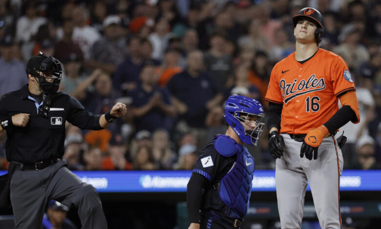 DETROIT, MI -  SEPTEMBER 13:  Coby Mayo #16 of the Baltimore Orioles reacts after being called out on strikes by home plate umpire Will Little n(L) with catcher Dillon Dingler #38 of the Detroit Tigers behind the plate in the ninth inning at Comerica Park on September 13, 2024 in Detroit, Michigan. (Photo by Duane Burleson/Getty Images)