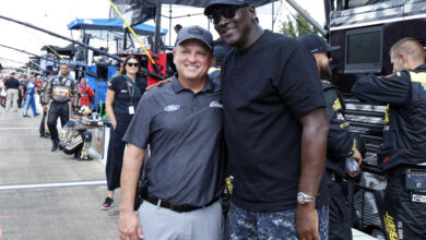 Bob Jenkins, owner of Front Row Motorsports and Co-Owner Michael Jordan, of 23XI Racing, pose before a NASCAR Cup Series auto race at Talladega Superspeedway, Sunday, Oct. 6, 2024, in Talladega, Ala. (AP Photo/ Butch Dill)