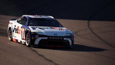 AVONDALE, ARIZONA - NOVEMBER 09: Denny Hamlin, driver of the #11 FedEx Toyota, drives during qualifying for the NASCAR Cup Series Championship Race at Phoenix Raceway on November 09, 2024 in Avondale, Arizona. (Photo by James Gilbert/Getty Images)