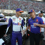 BRISTOL, TN - SEPTEMBER 21: Denny Hamlin (#11 Joe Gibbs Racing FedEx Toyota) and his crew chief Chris Gabehart talk prior to the running of the NASCAR Cup Series Bass Pro Shops Night Race on September 21, 2024, at Bristol Motor Speedway in Bristol, TN. (Photo by Jeffrey Vest/Icon Sportswire via Getty Images)