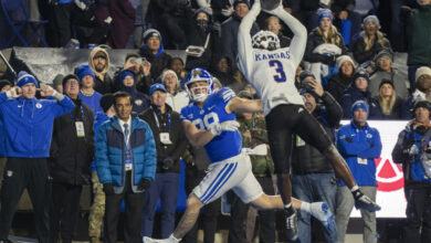 Kansas cornerback Mello Dotson (3) intercepts a pass in the endzone as BYU tight end Mata'ava Ta'ase (88) defends during the first half of an NCAA college football game Saturday, Nov. 16, 2024, in Provo. (AP Photo/Rick Egan)