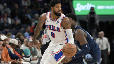 Philadelphia 76ers forward Paul George (8) handles the ball ahead of Memphis Grizzlies forward Jaren Jackson Jr. (13) in the first half of an NBA basketball game Wednesday, Nov. 20, 2024, in Memphis, Tenn. (AP Photo/Brandon Dill)