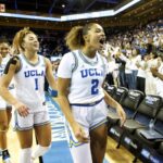 WESTWOOD, CA - NOVEMBER 24, 2024: UCLA Bruins guard Avary Cain (2), UCLA Bruins guard Kiki Rice (1) and UCLA Bruins forward Kendall Dudley (22) react after beating #1 ranked South Carolina at Pauley Pavilion on November 24, 2024 in Westwood, California. (Gina Ferazzi / Los Angeles Times)