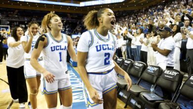 WESTWOOD, CA - NOVEMBER 24, 2024: UCLA Bruins guard Avary Cain (2), UCLA Bruins guard Kiki Rice (1) and UCLA Bruins forward Kendall Dudley (22) react after beating #1 ranked South Carolina at Pauley Pavilion on November 24, 2024 in Westwood, California. (Gina Ferazzi / Los Angeles Times)