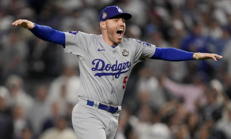 Los Angeles Dodgers first baseman Freddie Freeman celebrates his team's victory against the New York Yankees in Game 5 of the World Series. (AP Photo/Ashley Landis)