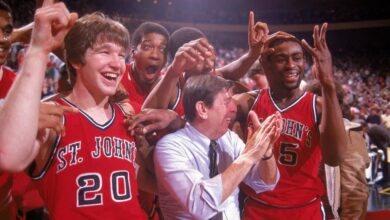 UNITED STATES - NOVEMBER 30:  College Basketball: Big East Tournament, St, John's coach Lou Carnesecca victorious with Chris Mullin (20) and Billy Goodwin (35) after winning Finals game vs Boston College, New York, NY 3/12/1983  (Photo by Andy Hayt/Sports Illustrated via Getty Images)  (SetNumber: X28169 TK8)